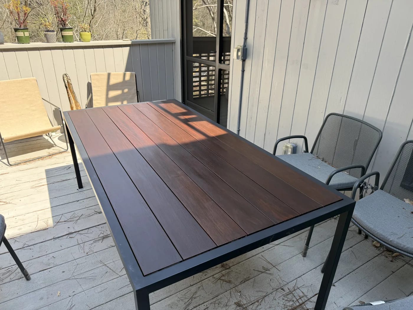 Exterior black metal frame table with refinished wood top