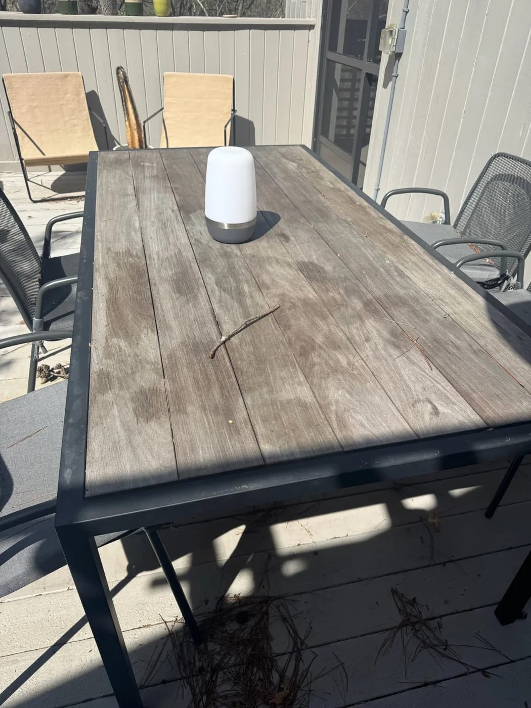 Weathered exterior black metal frame wood top table